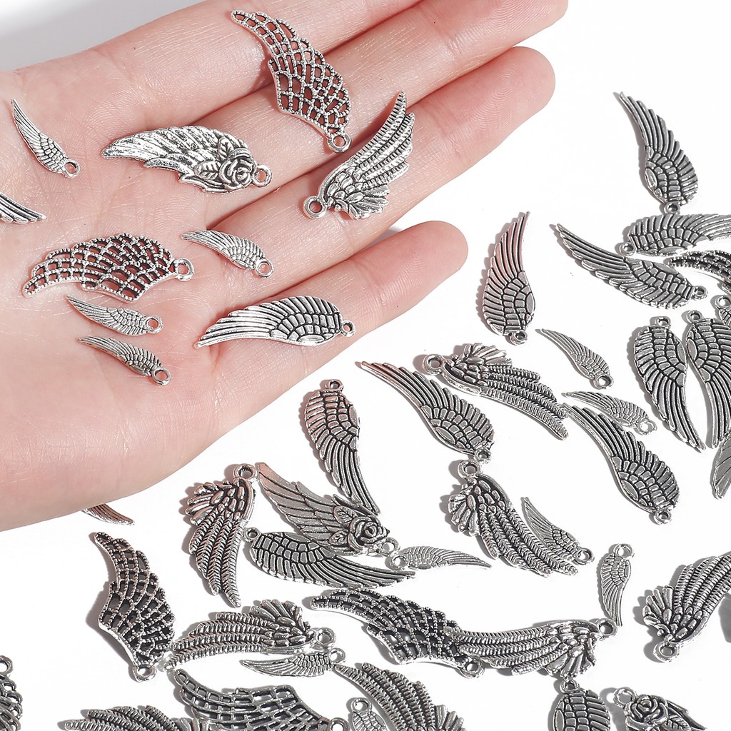 10 / 50pcs Charms Bentuk Sayap Bulu Kecil Warna Silver Antik Untuk Membuat Perhiasan Gelang Diy