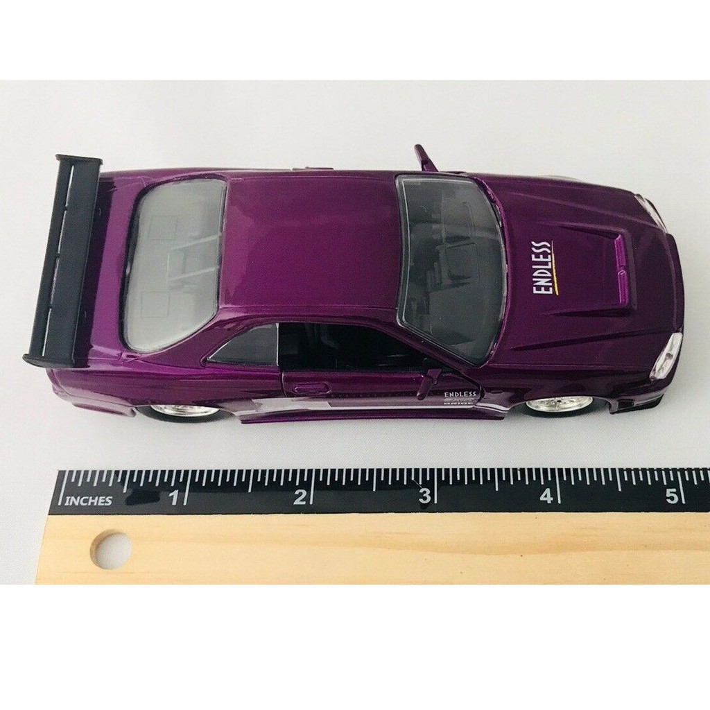 graatis Jada Toys diecast mobil 2002 Nissan Skyline GT-R (BNR34) skala 1/32