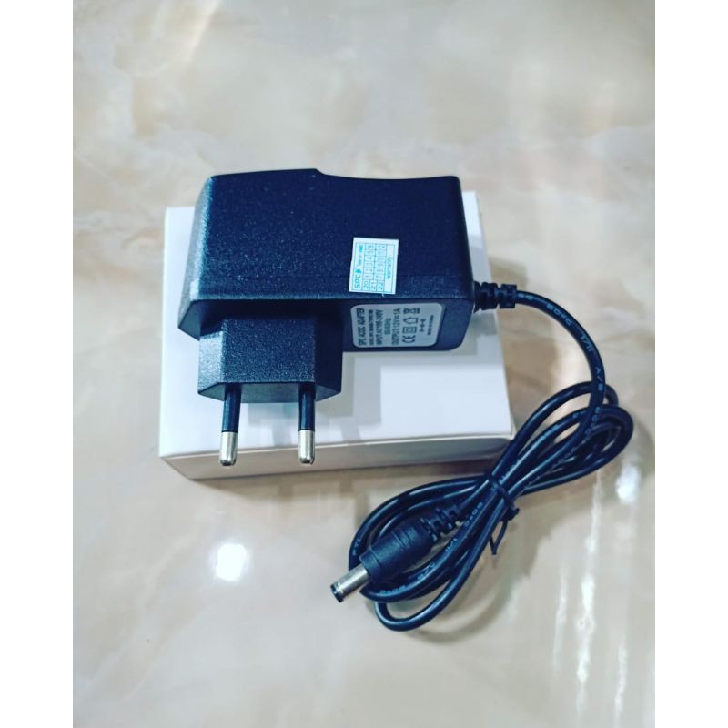 Adaptor Input AC100-240V-50-60Hz  Output DC-12V MURNI 1A