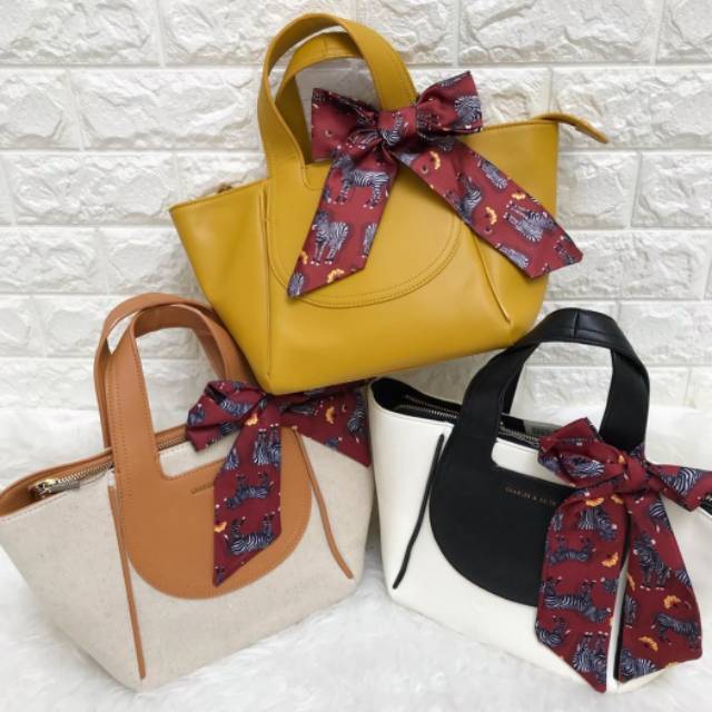 Tas cnk printed bow trapeze bag