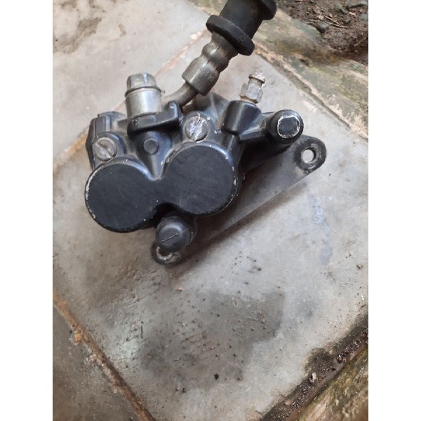 Kaliper cakram rem depan Supra X 125 Original copotan palababi bawah rem depan
