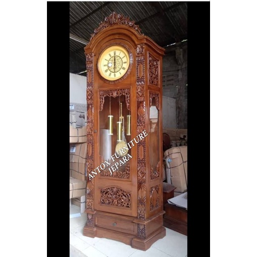 lemari jam kayu jati ukiran gebyok warna salak brown furniture Jepara