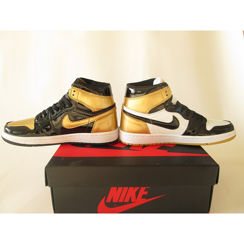 black and gold nike high tops