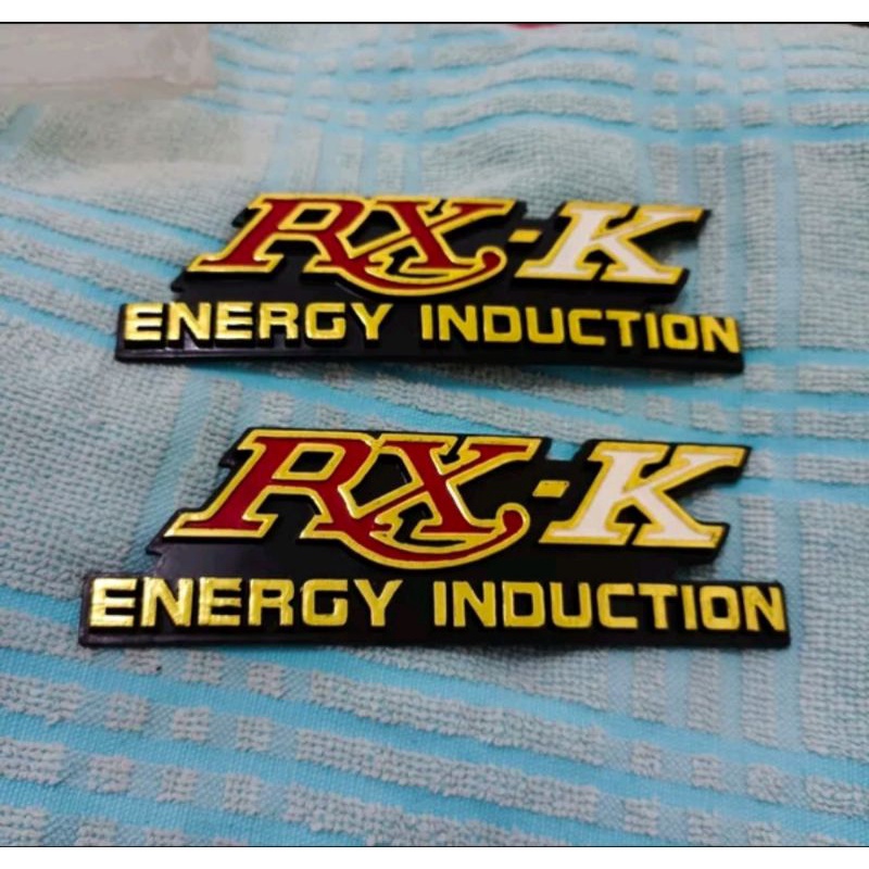 Emblem Logo Enblem box aki bos accu tutup batre cover batre Rxk Rx k RXK 135 Rx135 Nos
