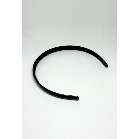 bando hitam polos bergerigi