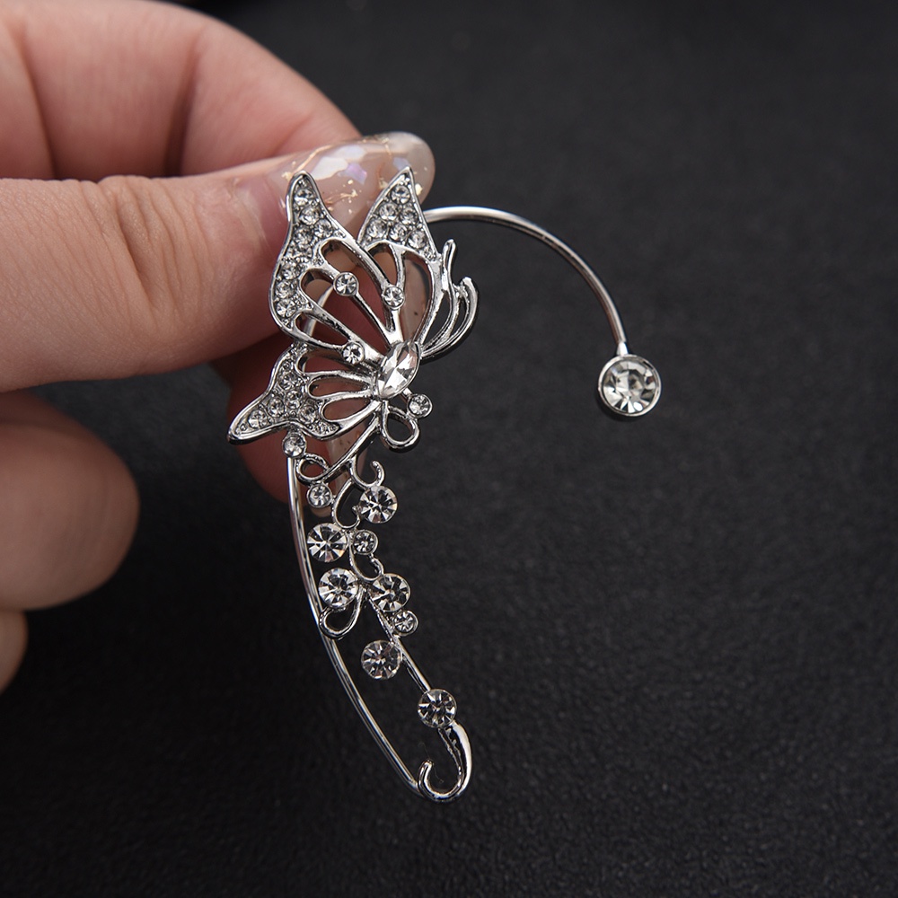 Anting Klip Desain Sayap Kupu-Kupu Hollow Hias Kristal Berlian Imitasi Gaya Korea Untuk Wanita