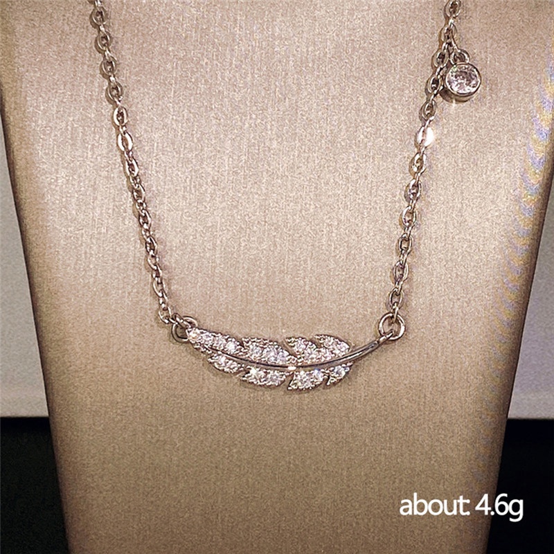 Kalung Bentuk Daun Aksen Kristal Warna Silver Untuk Wanita