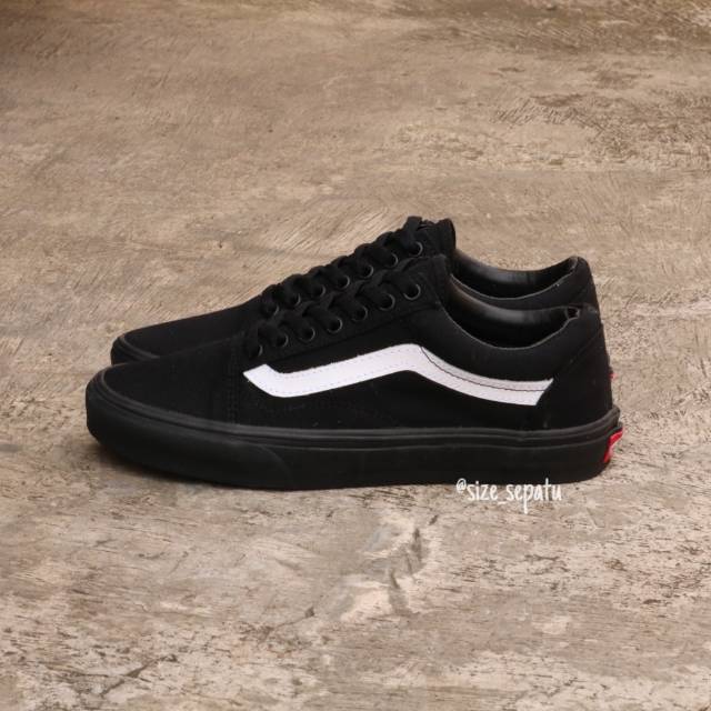 vans all black with white stripe