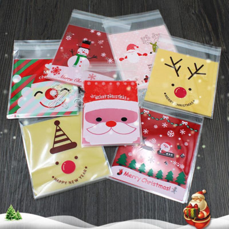 100pcs Kantong Plastik Cellophane Motif Natal Dengan Perekat Untuk Permen / Kue Kering