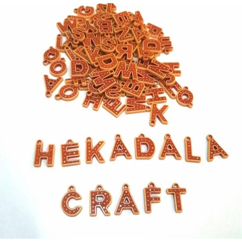 mote susu alfabet warna coklat batik