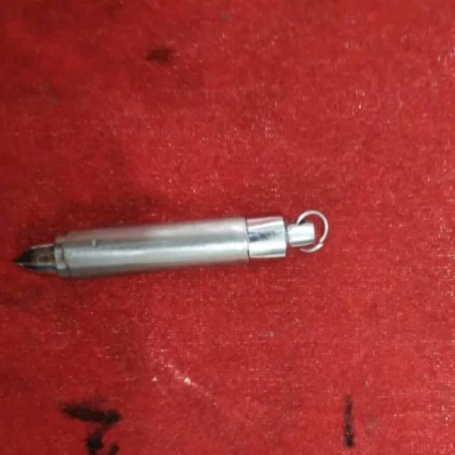 Liontin mainan Besi Putih maluku