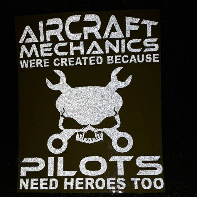 

Aircraft mechanics cutting sticker