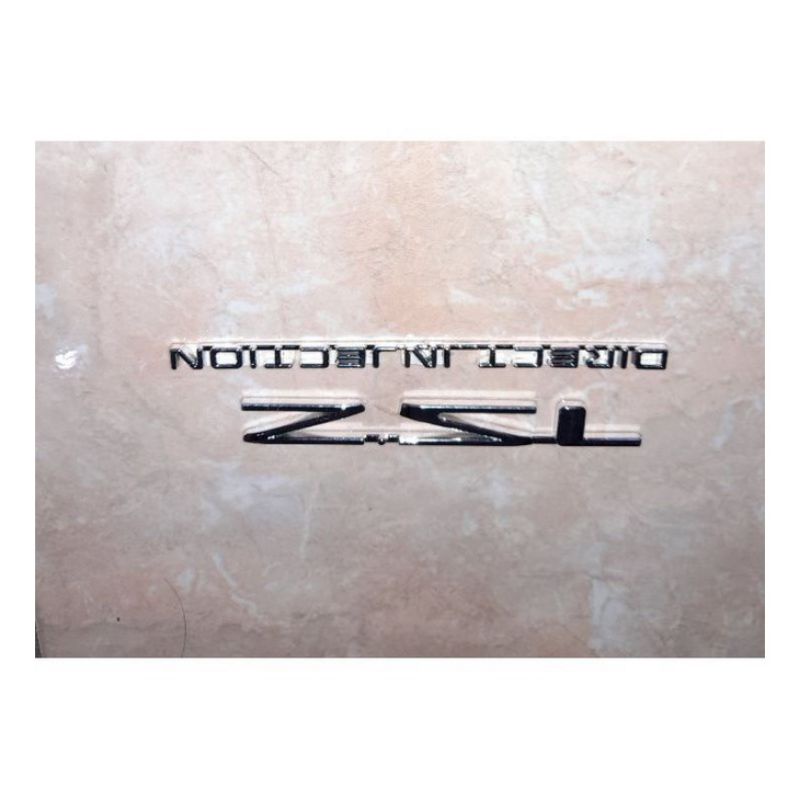 Emblem Logo 2.5 L Direct Injection Isuzzu Panther minibus Chrome / emblem 2,5 L direct injection