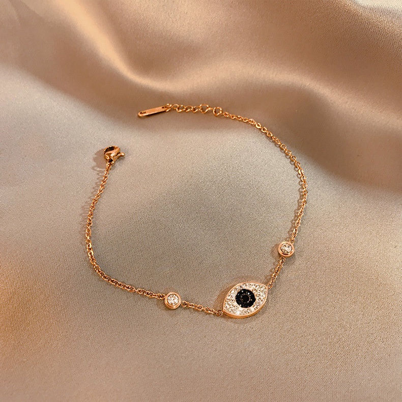 Gelang Tangan Rantai Baja Titanium Rose Gold 18K Aksen Mata Setan Untuk Wanita