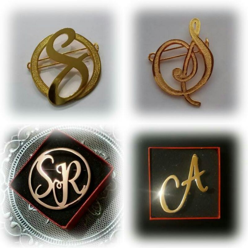 Bros ukir Huruf lapis emas