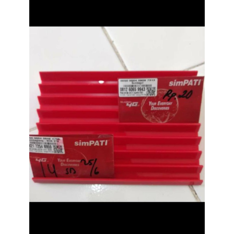 rak kartu perdana/voucher, warna orange terang
