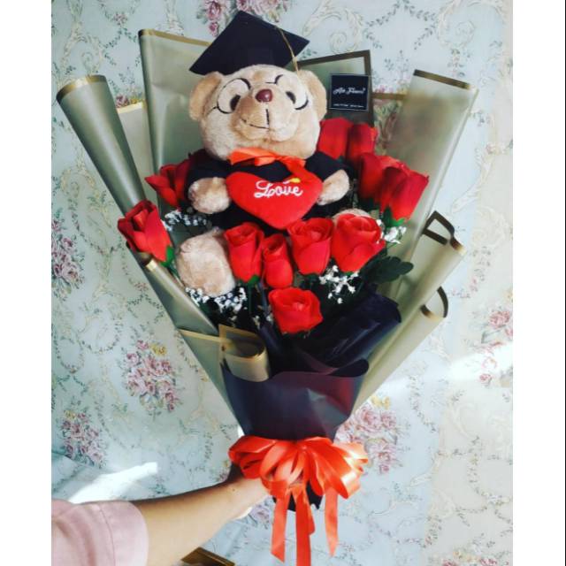 Buket boneka dan bunga  artifisial./Buket boneka