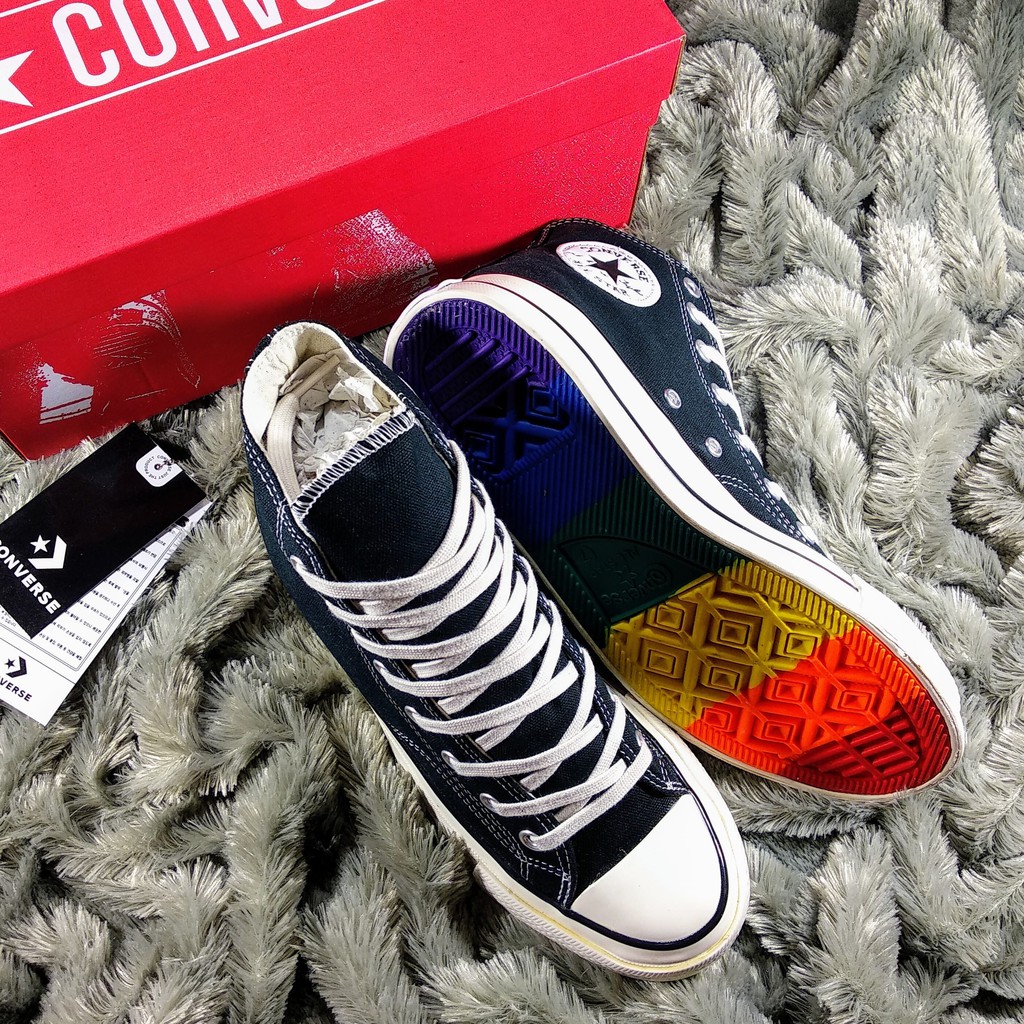 white converse rainbow bottom