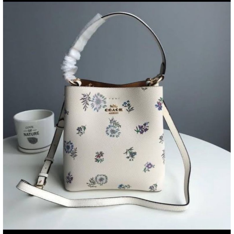 SMALL TOWN BUCKET BAG WITH DANDELION FLORAL PRINT (COACH 2310)