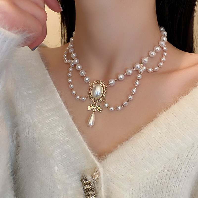 Kalung Desain Pita Oval Water Drop Aksen Mutiara Gaya Retro Korea