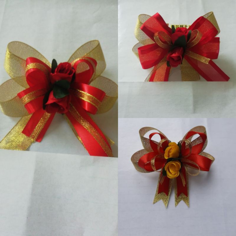 

Pita Kado Emas Merah