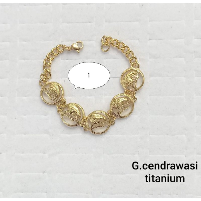 GELANG TANGAN TITANIUM MOTIF CENDRAWASIH WARNA EMAS