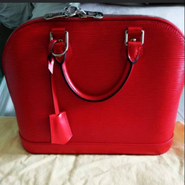 Louis Vuitton ALMA PM COQUELICOT 2014 madrid receipt