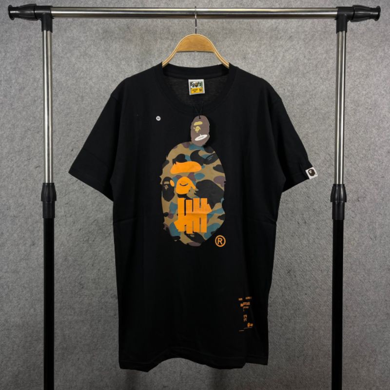 T-SHIRT BAPE X UNDEFEATED - KAOS DISTRO A BATHING APE - BAJU ATASAN PRIA BAPE