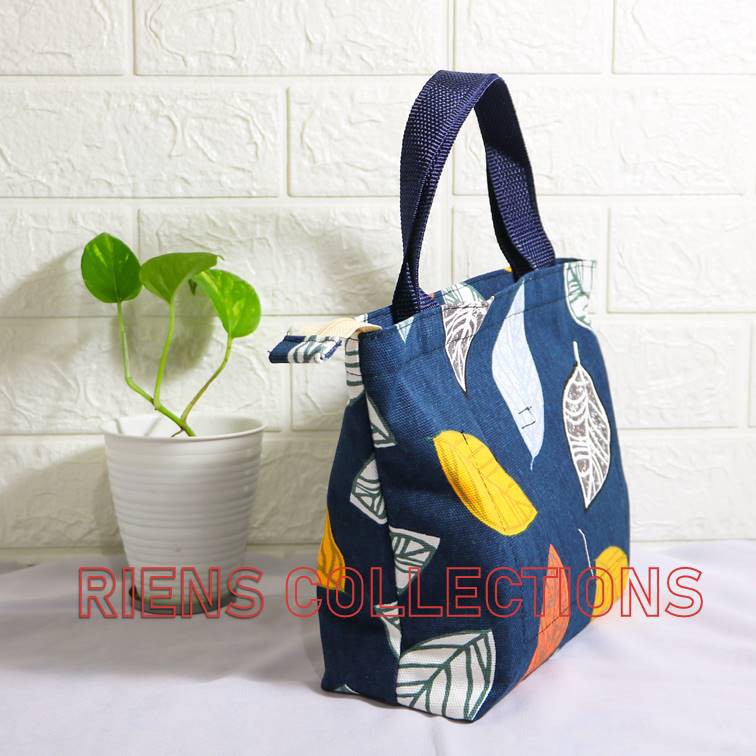 RIENS COLLECTIONS. HANDBAG KECIL BAHAN KANVAS MOTIF DAUN NANGKA BIRU