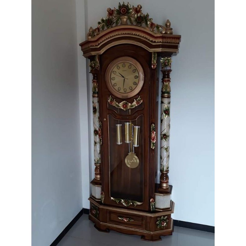 lemari jam sudut jati ukir