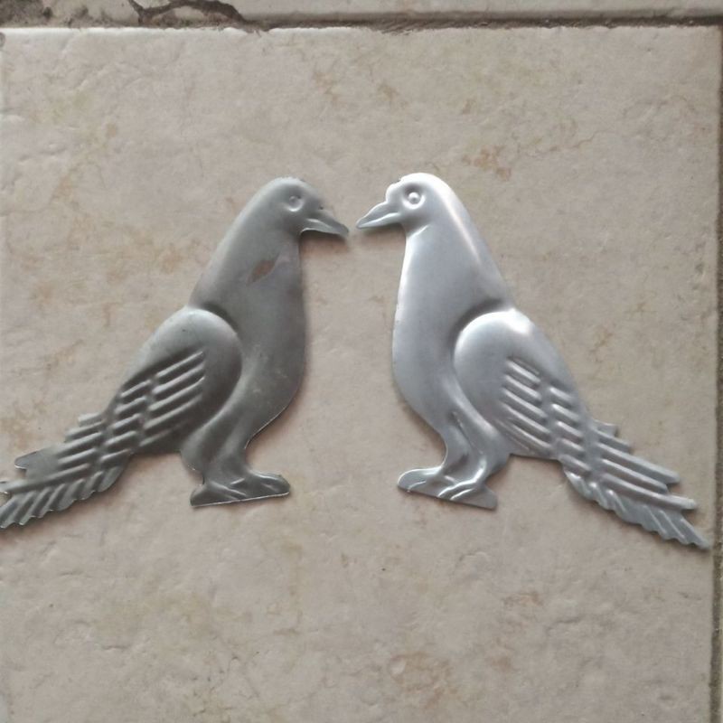 ORNAMEN PAGAR SEPASANG BURUNG MERPATI