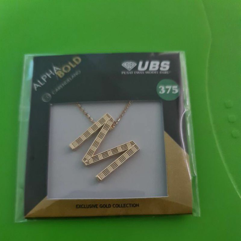 Kalung Alpha bold huruf M kadar 375 UBS