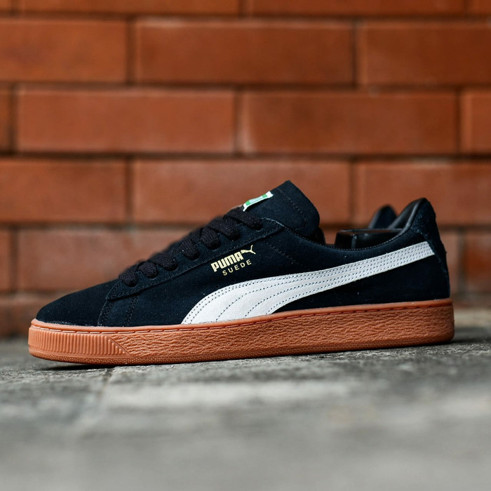 black suede pumas with brown sole