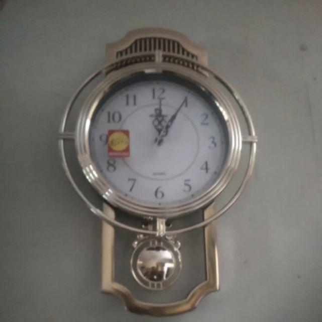 Jam Dinding Mirado Musik Bandul Goyang 937 Diameter 33cm