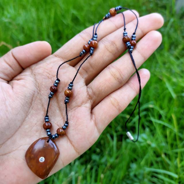 kalung daun manik mata coklat kokka kaokah