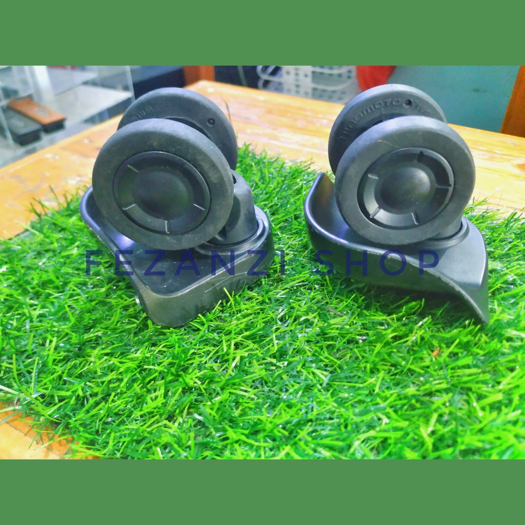 Dudukan roda koper merk bagasi