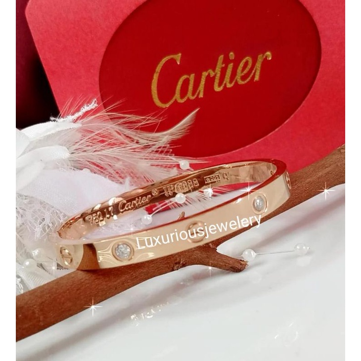 Gelang bangle tittanium ada grafir logo