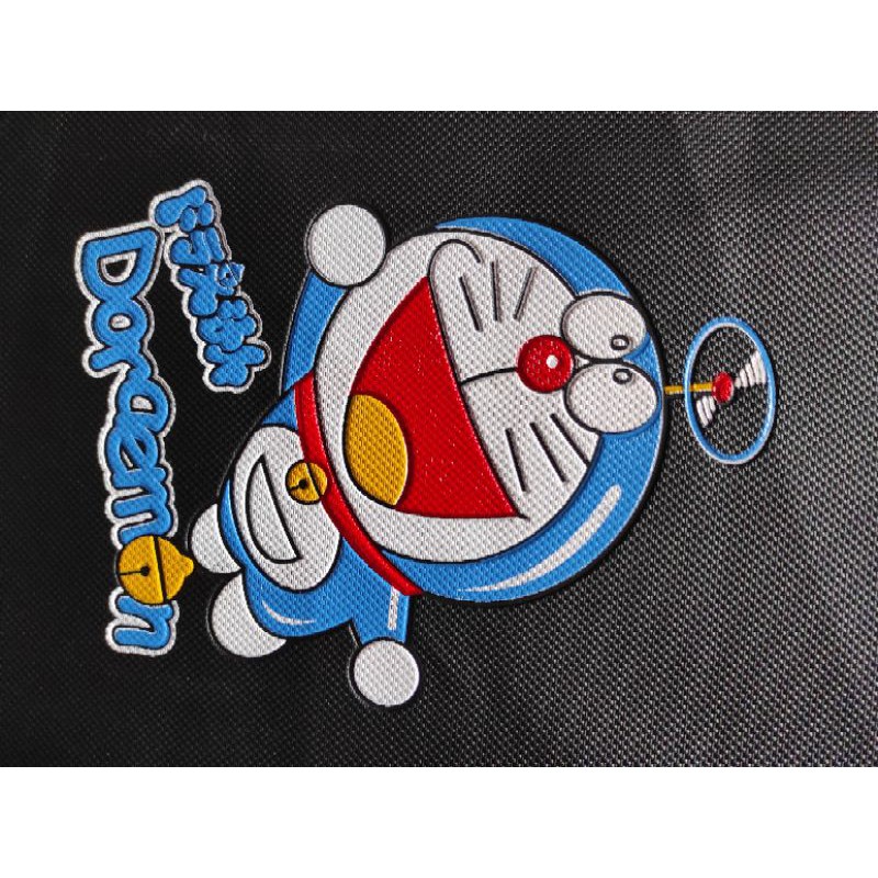 KULIT JOK MOTOR GAMBAR DORAEMON KECIL-SARUNG JOK MOTOR DORAEMON-COVER JOK MOTOR DORAEMON