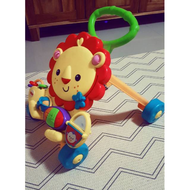 Baby push walker musical lion fisher price