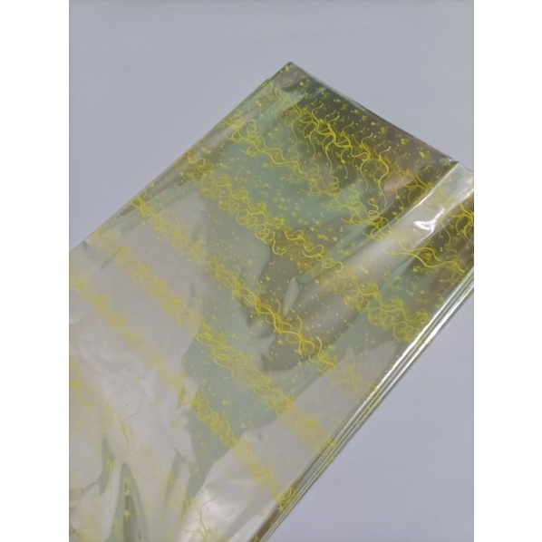 

plastik parcel motif lembaran ukuran 90x75 isi 10 lembar