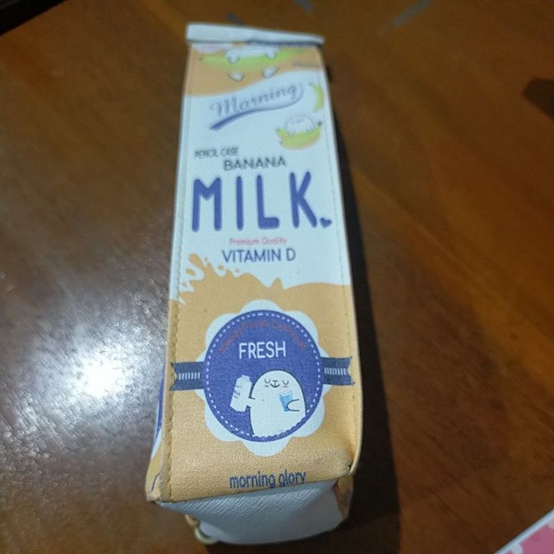 

tempat peslin bentuk susu kemasan