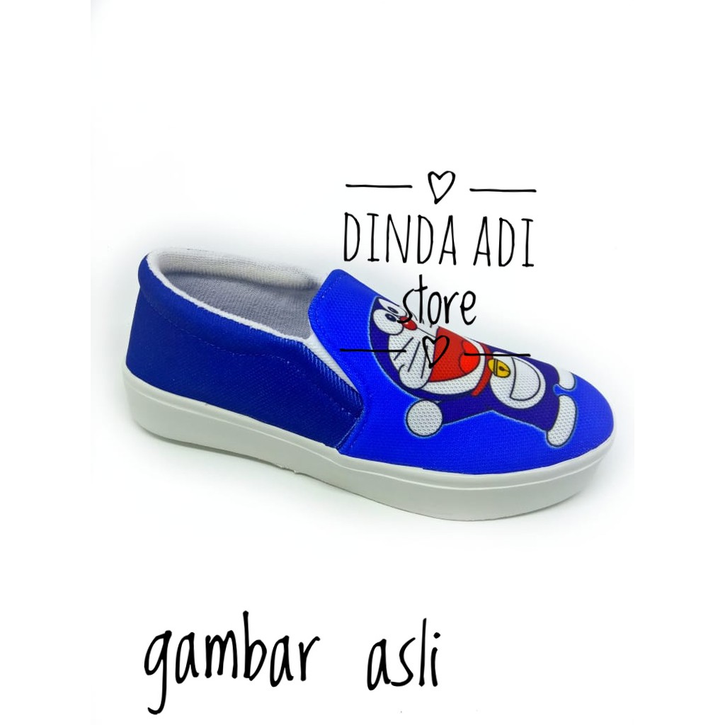 DINDA SEPATU WANITA SLIP ON DORAEMON REALPICT 100% MURAH - BIRU DAN HITAM