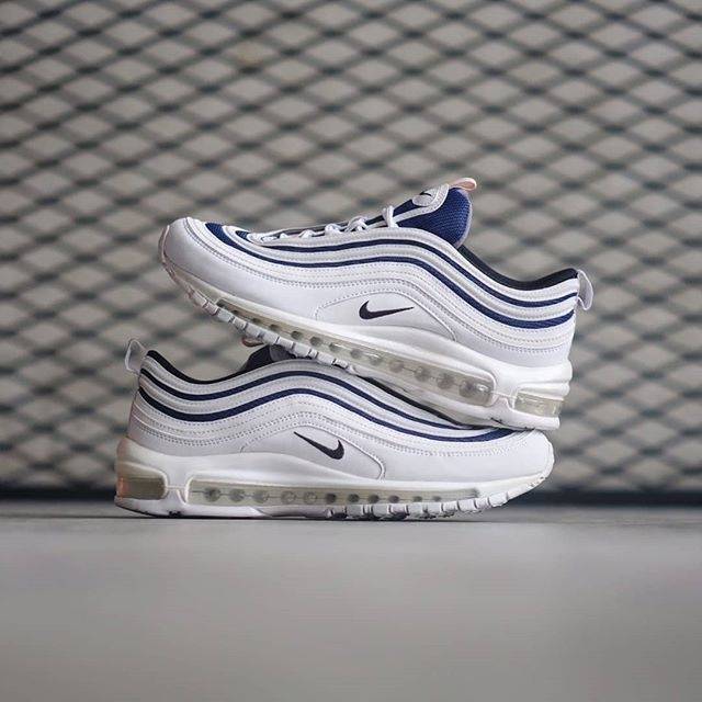 white and blue nike 97