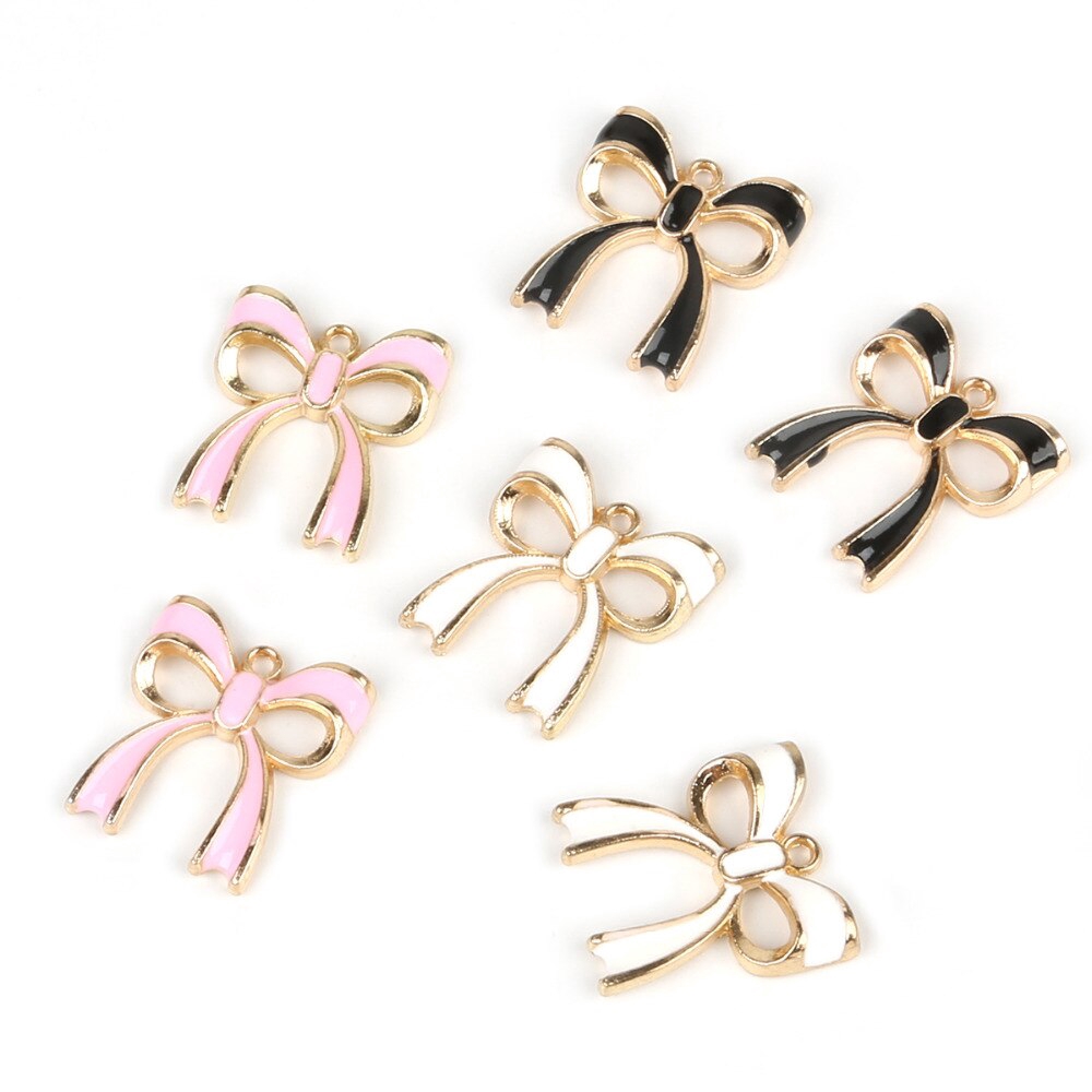 10pcs Liontin Bentuk Pita Warna Pink / Putih / Hitam Bahan Alloy Untuk Membuat Perhiasan