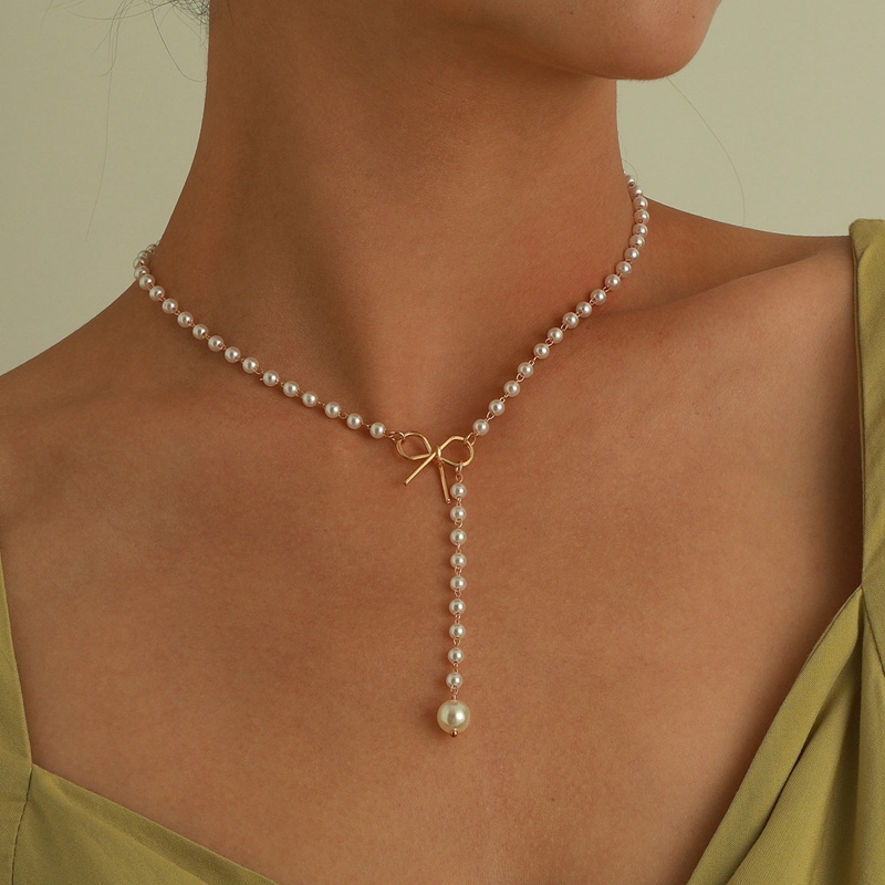 Kalung Liontin Mutiara Model Pita Rumbai Bahan Alloy Gaya Retro Untuk Wanita