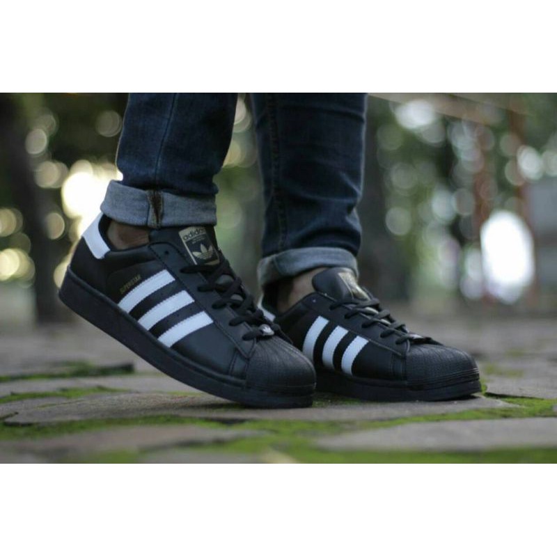 black adidas shoes superstar high top