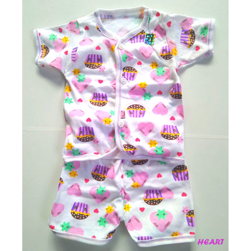 setelan bayi  SNI lengan pendek  plus celana  pendek  motif  