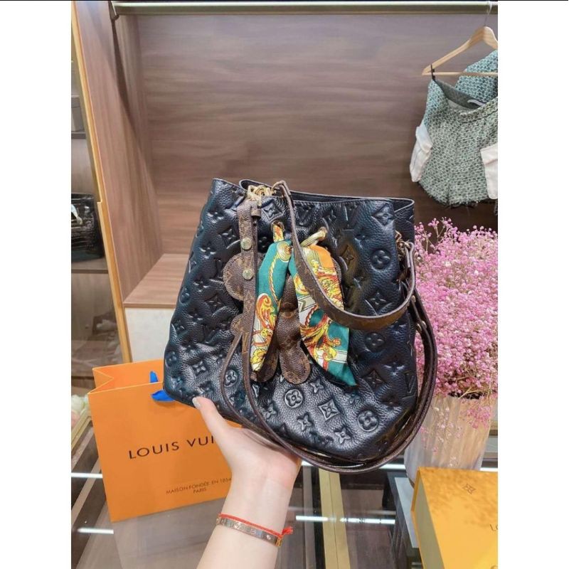 Lv bucket embossed list monogram