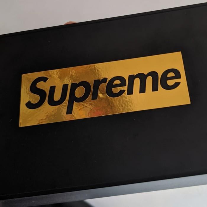 supreme logo gold