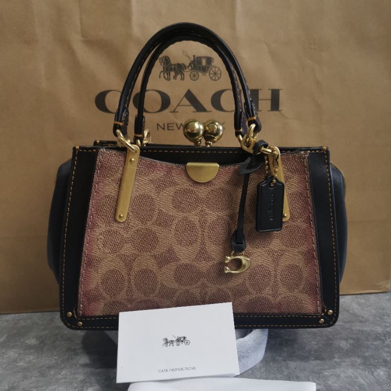 coach dreamer 21 kisslock sign black